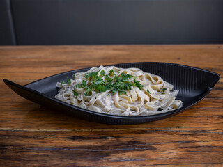 delicious traditional pasta on wooden restaurant table