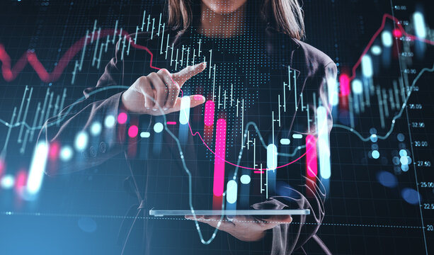 Businesswoman analyzing digital stock market chart on futuristic - Powered by Adobe