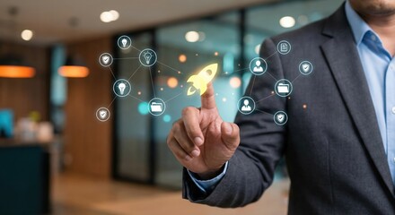 Southeast Asian Professional Adult Man Launching Startup Project with Digital Rocket Icon on Virtual Screen Interface, Concept of Business Growth and Innovation in Modern Office Setting