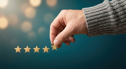 Adult man in a grey sweater placing a golden star for a five star rating review on a teal background, illustrating customer satisfaction, business excellence, and quality service feedback.