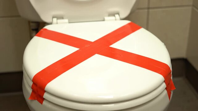 Toilet Out of Order: Red Tape 'X' Meaning