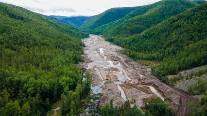 View from above. Mining of loose gold. A river destroyed by gold miners. A developed field in the taiga.