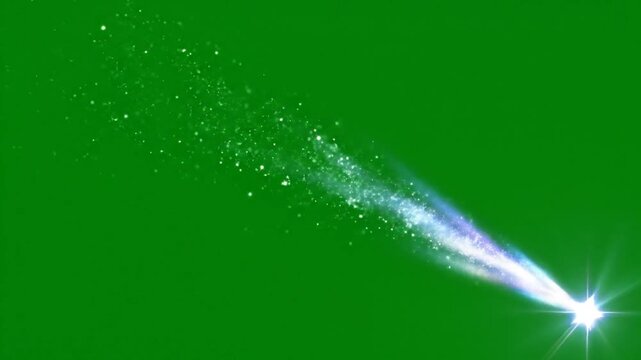 Comet streaks across the green screen with a trail of sparkling particles