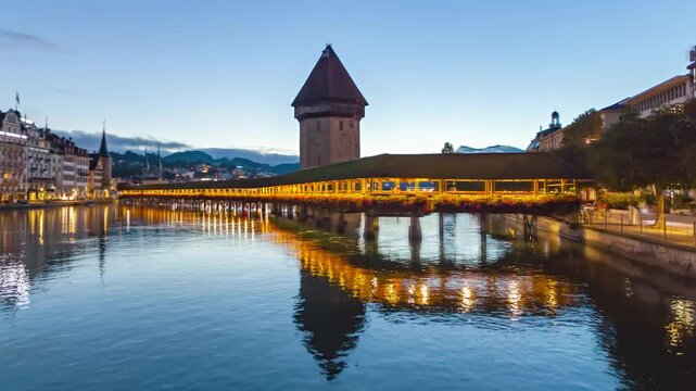 Night to day hyper lapse panorama Lucerne old town and Chapel bridge (Kapellbrucke), Switzerland.
