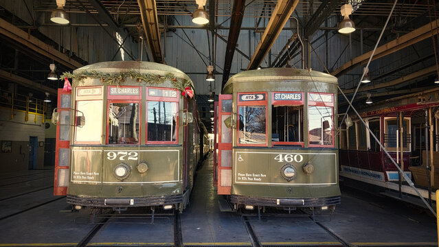 Two New Orleans streetcars in the Uptown Carrollton Station barn