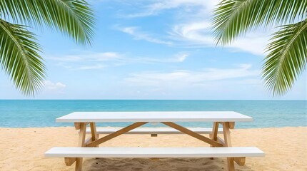 Obraz premium Empty white wooden picnic table on a tropical sandy beach with turquoise ocean water with copy space