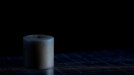 Businessman watching stock market graph at sunset concept. A candle burns in the foreground with a blurred stock market chart behind. - Powered by Adobe