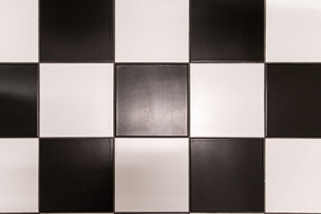 Classic checkerboard pattern with alternating black and white square tiles, creating a versatile geometric background for modern interior design projects