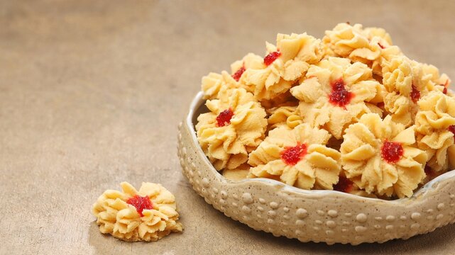 Semprit mawar or biskut semperit dahlia are a traditional cake popular during Eid Al Fitr. These cookies are shaped like roses