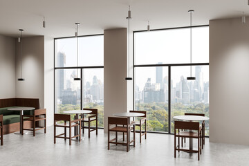 Fototapeta premium Modern cafe interior with minimalist wood furniture and panoramic city view through large windows in bright daylight setting. 3D Rendering