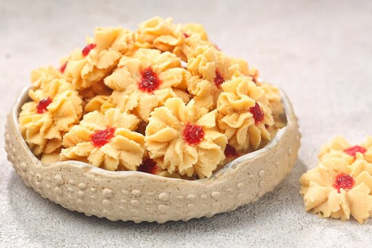 Semprit mawar or biskut semperit dahlia are a traditional cake popular during Eid Al Fitr. These cookies are shaped like roses