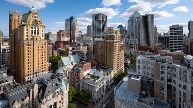Urban Oasis: A panoramic view showcases a bustling cityscape under a vibrant blue sky, highlighting a dense collection of diverse buildings that define urban life.