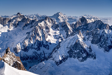 Sharp peaks in the Alps in winter, Chamonix-Mont-Blanc, snow-covered mountains. The most beautiful mountain landscapes in Europe.