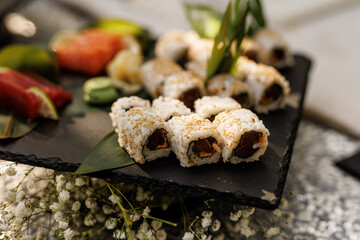 Sushi Platter With Rolls, Tuna and Salmon on Slate Board