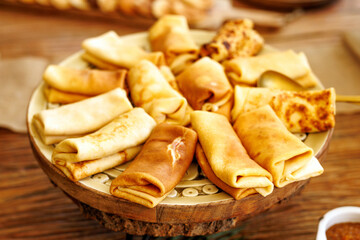 Assorted Rolled Pancakes Arranged on Serving Plate