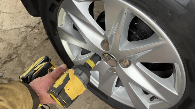 cordless impact wrench tighten wheel lug nut side angle