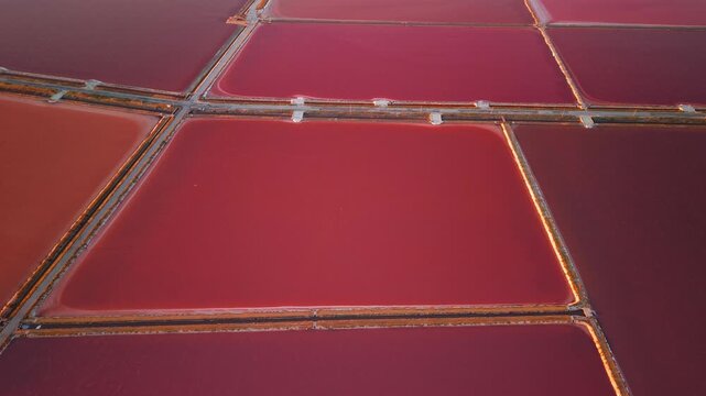Aerial view of the Margherita di Savoia salt mines at sunset in Puglia, Italy