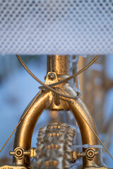 Front view of a decorative golden bicycle. The Concept of Art.