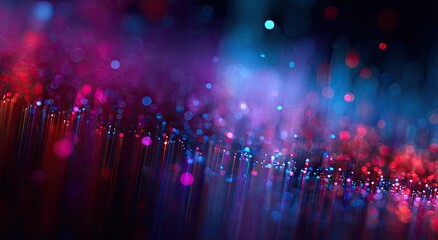 Abstract light strings fade from red/purple to blue with bokeh