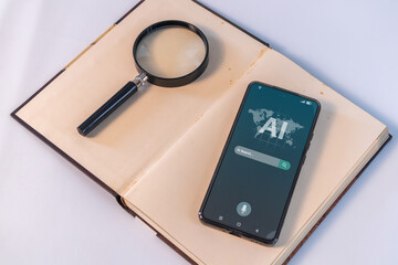 A smartphone with AI search engine bar for data search. A smartphone and a magnifying glass on top of a book.