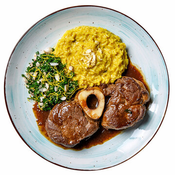 Hearty osso buco with gremolata and yellow risotto served on a plate for a comforting gourmet dish