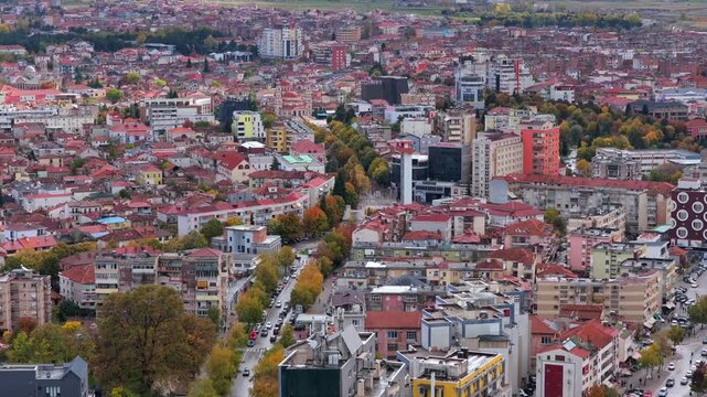 Aerial video of Kor&ccedil;&euml; in southeast Albania showing dense neighbourhoods and  colourful rooftops. 