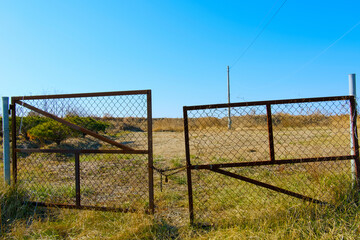 The iron gates and the likely scenery behind them