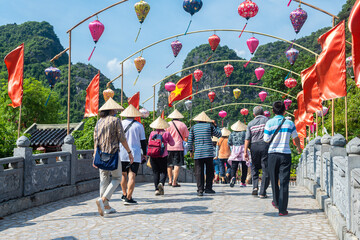 a group of tourist are walking