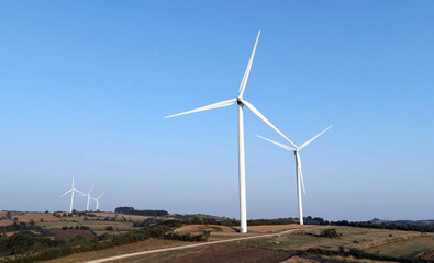 wind turbines field on a background of blue sky