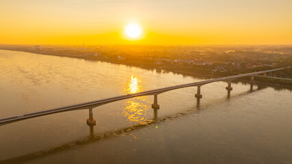 Stunning aerial hyper lapse of a glowing sunset over the Friendship Bridge and surrounding city...
