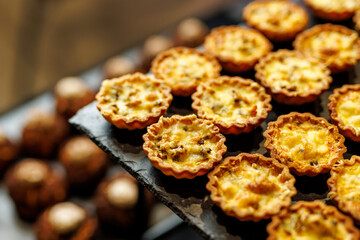 Mini quiche tartlets on tray