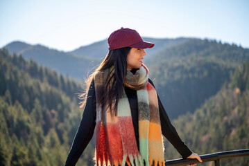 Beautiful  young woman standing  in the autumn mountain 
