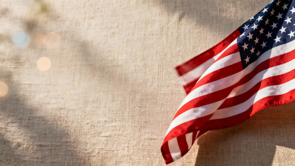 Obraz premium Vintage American flag waving gently against a textured background with soft bokeh lights