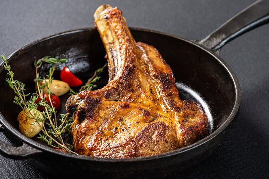 Juicy Tomahawk Pork Chop In Cast Iron Pan