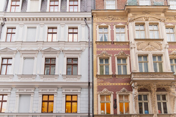 Fototapeta premium Historic classical architecture in Riga featuring richly decorated apartment house facades detailed window frames and preserved ornamental elements in urban streetscape