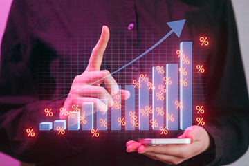 Business person shows growth chart while using smartphone in a modern office setting with a focus on success and progress