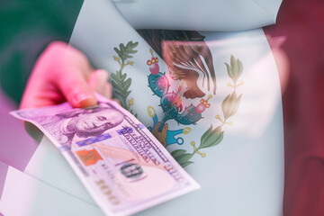 Hand holding a dollar bill in front of Mexican flag during a currency exchange event