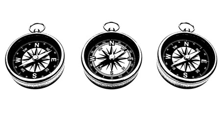 Set of three vintage compasses in black and white
