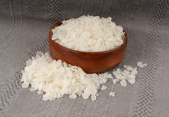 Raw flattened rice isolated. Dry rice flakes or poha, Indian breakfast food