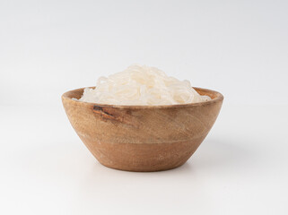 Shirataki or konnyaku pasta in wood bowl isolated. Konjak jelly noodles, Japanese zero calorie sirataki