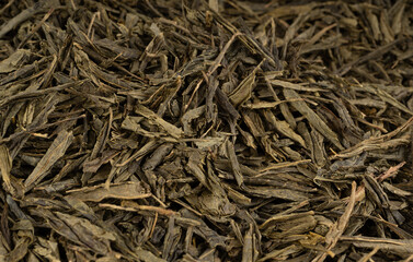 Green tea leaves macro textured background