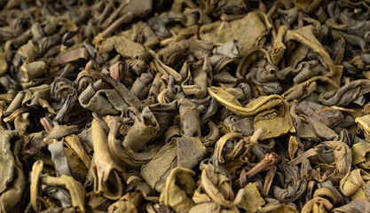 Green tea leaves macro textured background