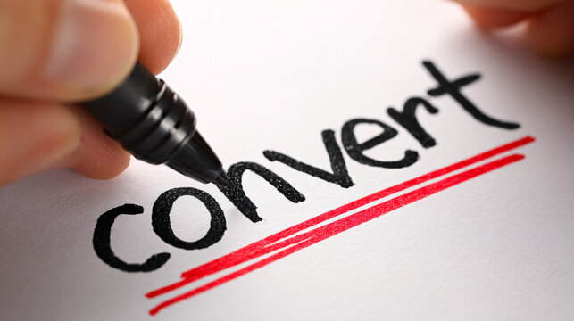 Hand writing convert with marker on white paper closeup