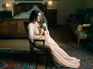 Beautiful young woman in nightgown boudoir photo