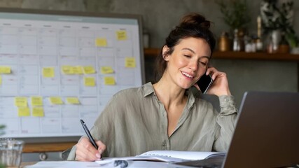 Remote administrative assistant managing scheduling and documentation from a home office during a busy workday.