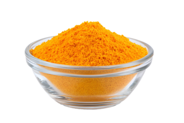 Bright orange spice powder piled high in a clear glass bowl isolated on transparent background