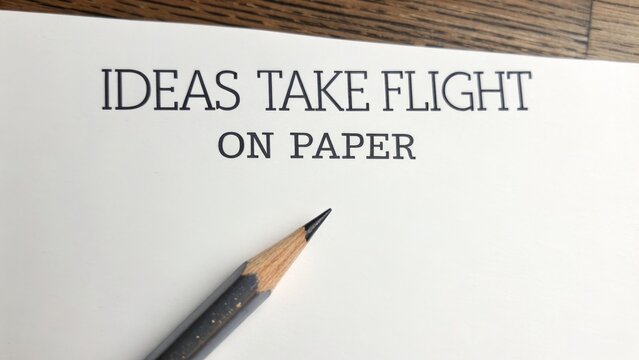 Sharp Pencil Poised Above Paper with Inspirational Text
