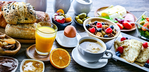 Breakfast served with coffee, juice, croissants and egg