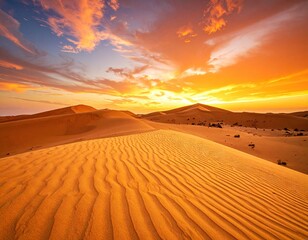 Golden desert dunes glow under a vibrant sunset sky with dramatic clouds.
