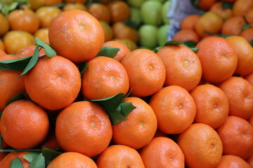Closeup of ripe orange citrus fruit stack